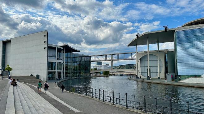 modern buildings either side of a river
