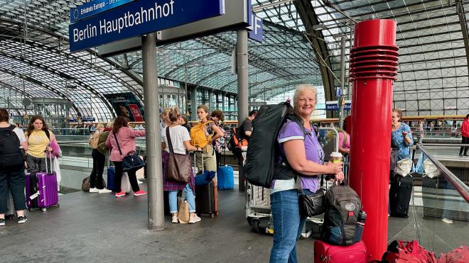 Karen standing on a train platform in Berlin