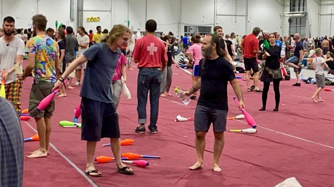 &ldquo;two people with three clubs and a water bottle&rdquo;