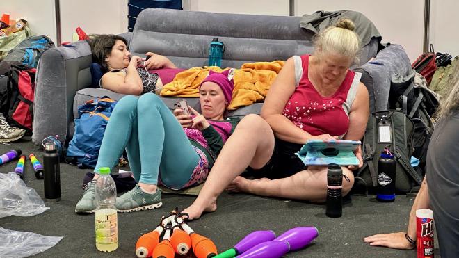 &ldquo;three women crashed on and beside a couch using phones and tablets&rdquo;