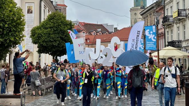 &ldquo;the front of a parade of jugglers&rdquo;