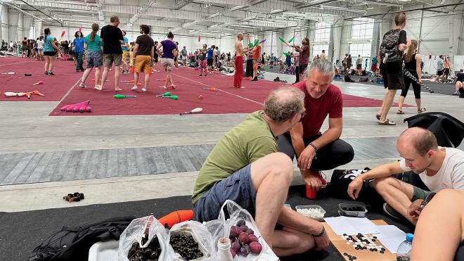 &ldquo;a view from the passing zone space including three people playing Go&rdquo;