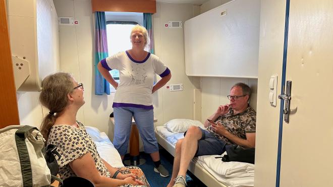 &ldquo;three people in a small ferry cabin with for bunks&rdquo;