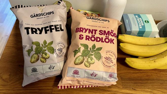 &ldquo;two bags of chips, some bananas and a box of sugar cubes on a table&rdquo;