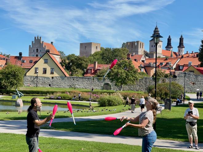 &ldquo;Maria and Greg juggling six pink clubs outside the Visby city walls&rdquo;